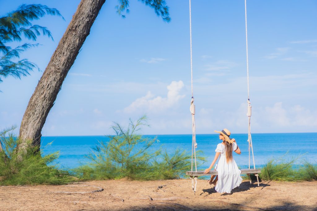 portrait-beautiful-young-asian-woman-relax-smile-swing-around-beach-sea-ocean-nature-travel-vacation (1)